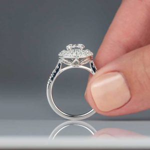 closeup-of-woman-holding-diamond-engagement-ring-9SLBPJU.jpg